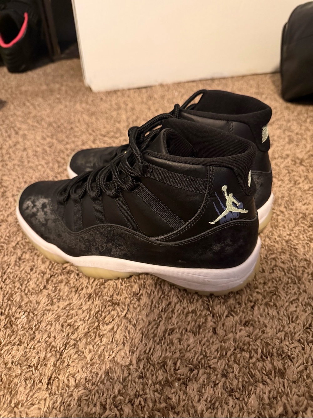 Jordan Retro 11 “Inner Beast” Sneakers in Black and White with Pale Blue Jumpman
